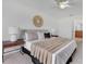 Serene main bedroom features a ceiling fan, ample natural light, and tasteful decor at 200 Cimarron Dr, Kissimmee, FL 34759