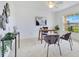 Stylish home office with a desk, seating area and window view of the outdoors at 200 Cimarron Dr, Kissimmee, FL 34759