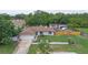 An aerial view of the well maintained property showcases a fenced yard and cozy home with mature trees at 2112 Plymouth Sorrento Rd, Apopka, FL 32712