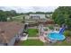 Aerial view of the backyard featuring a pool, patio, and lush greenery at 2112 Plymouth Sorrento Rd, Apopka, FL 32712