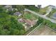 Aerial view of a residential property with backyard pool, storage areas, mature trees, and a well-kept lawn at 2112 Plymouth Sorrento Rd, Apopka, FL 32712