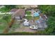 Aerial view showcasing a pool, boat, and a green backyard at 2112 Plymouth Sorrento Rd, Apopka, FL 32712