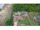 Aerial view of the property with a pool, backyard buildings, mature trees, and a well-kept lawn at 2112 Plymouth Sorrento Rd, Apopka, FL 32712
