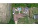 Overhead view of the property with a pool, storage sheds, mature trees, a well-kept lawn, and privacy fencing at 2112 Plymouth Sorrento Rd, Apopka, FL 32712