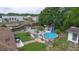Aerial view showcasing a pool and lush green space at 2112 Plymouth Sorrento Rd, Apopka, FL 32712