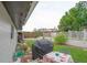 Landscaped backyard featuring a well-maintained lawn and outdoor dining area with barbecue grill at 2112 Plymouth Sorrento Rd, Apopka, FL 32712