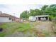 Backyard featuring a trailer, boat, and a partially open garage at 2112 Plymouth Sorrento Rd, Apopka, FL 32712