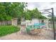 Inviting backyard featuring a patio area, lush landscaping, and a refreshing above-ground pool at 2112 Plymouth Sorrento Rd, Apopka, FL 32712