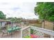 Relaxing backyard with outdoor dining area, shed, and mature trees at 2112 Plymouth Sorrento Rd, Apopka, FL 32712