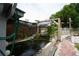 Backyard Koi pond featuring an intricate waterfall and lush landscaping at 2112 Plymouth Sorrento Rd, Apopka, FL 32712