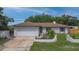 Charming single-story home featuring a well-manicured lawn, attached garage, and inviting curb appeal at 2112 Plymouth Sorrento Rd, Apopka, FL 32712