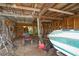 Garage interior with a boat, lawn mower, and tools at 2112 Plymouth Sorrento Rd, Apopka, FL 32712