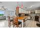 Bright kitchen with a breakfast bar, appliances, seamlessly connects to the living area at 2112 Plymouth Sorrento Rd, Apopka, FL 32712