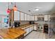 A bright kitchen with an island, white cabinets, and stainless steel appliances at 2112 Plymouth Sorrento Rd, Apopka, FL 32712