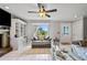 Bright living room features large window, tile flooring, fireplace, and built-in shelving at 2112 Plymouth Sorrento Rd, Apopka, FL 32712