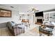 Open-concept living room with white tile floors, a brick fireplace, and view of the dining area at 2112 Plymouth Sorrento Rd, Apopka, FL 32712