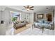 Comfortable living room with tile floors, ample seating, and a bright window view at 2112 Plymouth Sorrento Rd, Apopka, FL 32712