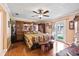 Spacious main bedroom with hardwood floors, ceiling fan, and French doors to the backyard at 2112 Plymouth Sorrento Rd, Apopka, FL 32712