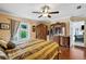 Large main bedroom with hardwood floors, ceiling fan, and access to backyard at 2112 Plymouth Sorrento Rd, Apopka, FL 32712