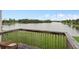 Backyard deck overlooking the lake and green grass under a blue sky at 214 Majors Ln # B, Kissimmee, FL 34743