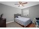 Cozy bedroom with hardwood floors, a comfortable bed, and a bright window, offering a peaceful retreat at 214 Majors Ln # B, Kissimmee, FL 34743