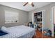 Bedroom with a window and closet with items on the shelves and a ceiling fan at 214 Majors Ln # B, Kissimmee, FL 34743