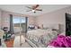 Bedroom featuring a sliding glass door to the deck and a ceiling fan at 214 Majors Ln # B, Kissimmee, FL 34743