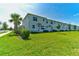 Townhome backyard featuring a well-manicured lawn and patio area at 224 Nine Iron Dr, Davenport, FL 33896