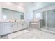 Bathroom features a double vanity, shower stall, and soaker tub at 224 Nine Iron Dr, Davenport, FL 33896