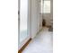 Clean bathroom design featuring ceramic tile, a frosted glass door, and well-placed accents for a refreshing and modern feel at 224 Nine Iron Dr, Davenport, FL 33896