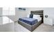 Stylish bedroom with a modern headboard, side table, and sleek decor at 224 Nine Iron Dr, Davenport, FL 33896