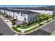 New townhome with manicured landscaping, paver driveway and attached garage at 224 Nine Iron Dr, Davenport, FL 33896