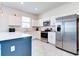 Modern kitchen featuring stainless steel appliances, white cabinetry, and a sleek countertop at 224 Nine Iron Dr, Davenport, FL 33896