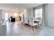 Spacious open-concept living area with tile floors, dining area, and a kitchen, ideal for entertaining and modern living at 224 Nine Iron Dr, Davenport, FL 33896