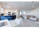 Open-concept living space features modern kitchen, dining area, and a comfortable living room at 224 Nine Iron Dr, Davenport, FL 33896