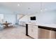 Open-concept living space features modern kitchen, dining area, and a comfortable living room at 224 Nine Iron Dr, Davenport, FL 33896