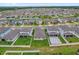 An aerial view shows the home in a neighborhood of many homes at 2311 Bear Peak Rd, Clermont, FL 34715