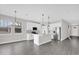 Open kitchen with stainless steel appliances, a center island, and plenty of cabinet space at 2311 Bear Peak Rd, Clermont, FL 34715