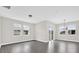 Spacious living room with abundant natural light, hardwood floors, and a sliding glass door at 2311 Bear Peak Rd, Clermont, FL 34715