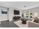 Bright living room with contemporary furniture, large windows, and stylish decor at 2311 Bear Peak Rd, Clermont, FL 34715