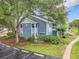 The exterior of the home featuring lush landscaping and parking at 2580 Grassy Point Dr # 106, Lake Mary, FL 32746