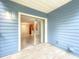 Screened-in patio with tiled floors, looking into living spaces through sliding glass doors at 2580 Grassy Point Dr # 106, Lake Mary, FL 32746