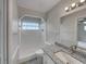 Bathroom with vanity, granite countertop, shower and tiled floor at 2710 Wyndham Ln, Orlando, FL 32808