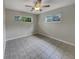 Well-lit bedroom with tile flooring and neutral walls, providing a serene and peaceful space at 2710 Wyndham Ln, Orlando, FL 32808