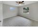 Bright bedroom with tiled floor, ceiling fan and dual windows at 2710 Wyndham Ln, Orlando, FL 32808