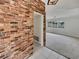 Entryway with brick accent wall leading into a spacious living area at 2710 Wyndham Ln, Orlando, FL 32808