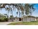 Charming single-story home with a well-maintained front yard and unique carport design at 2710 Wyndham Ln, Orlando, FL 32808