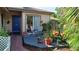 Relaxing back patio with brick pavers, lush foliage, and comfortable seating area at 2922 Burlington Dr, Apopka, FL 32703