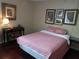 Comfortable bedroom with classic decor and plenty of natural light from a nearby window at 2922 Burlington Dr, Apopka, FL 32703