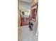Inviting foyer with tile flooring, hardwood and views of the open living area at 2922 Burlington Dr, Apopka, FL 32703